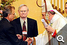 In a dedication mass for St. Joseph Parish on October 18, George Leasure hands the keys to Bishop David Zubik and parish officials to commission their new sanctuary.